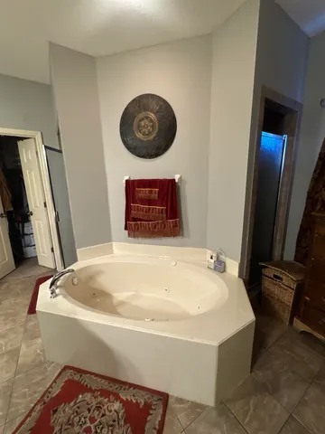 a bathroom with a tub and a sink