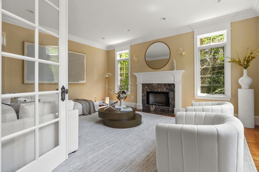 22 Scotney Road Newton, MA 02467 - Photo 13 of 42 a living room with furniture a fireplace and a large window