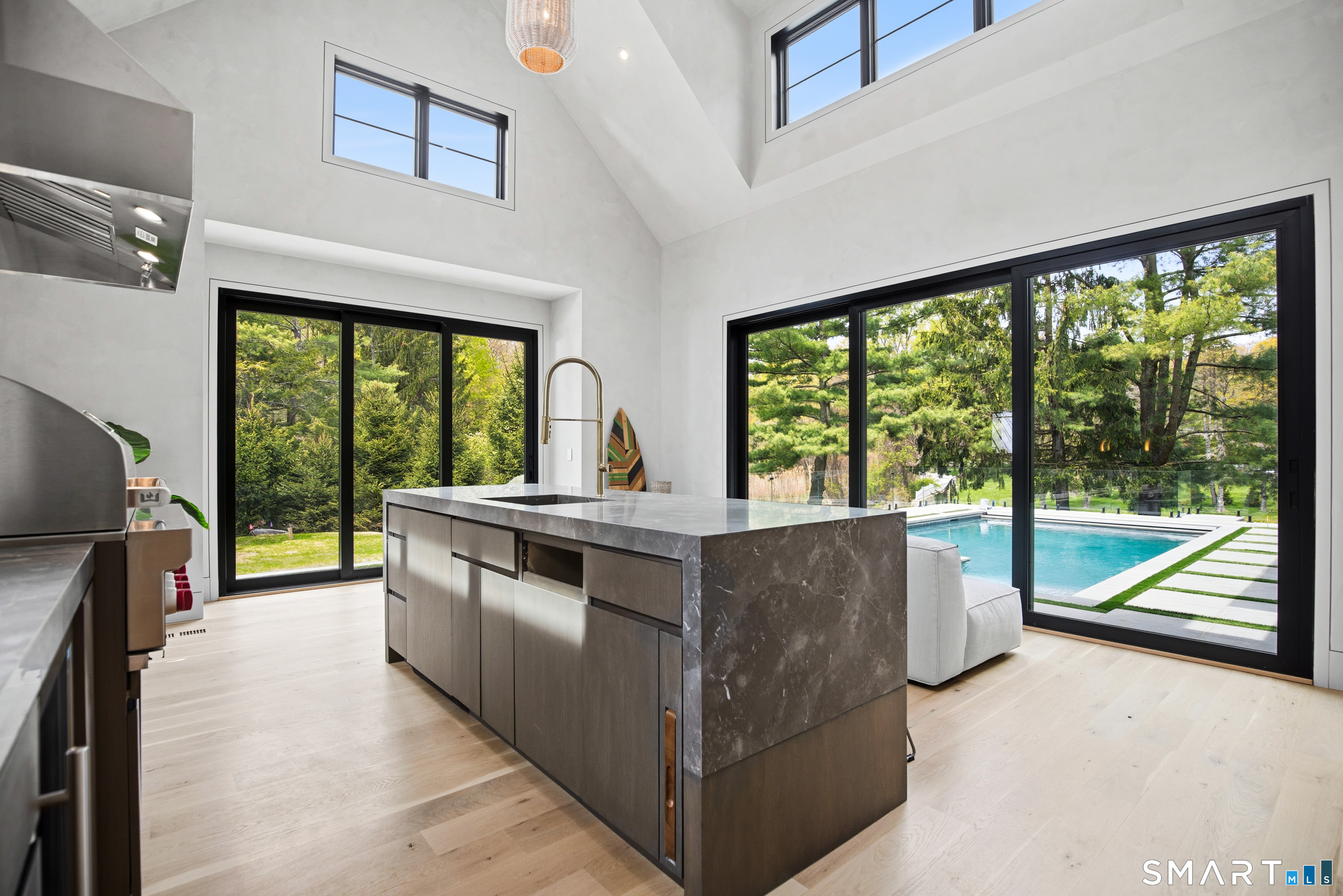 259 Frogtown Road New Canaan, CT 06840 - Photo 15 of 39 a living room with furniture and a large window