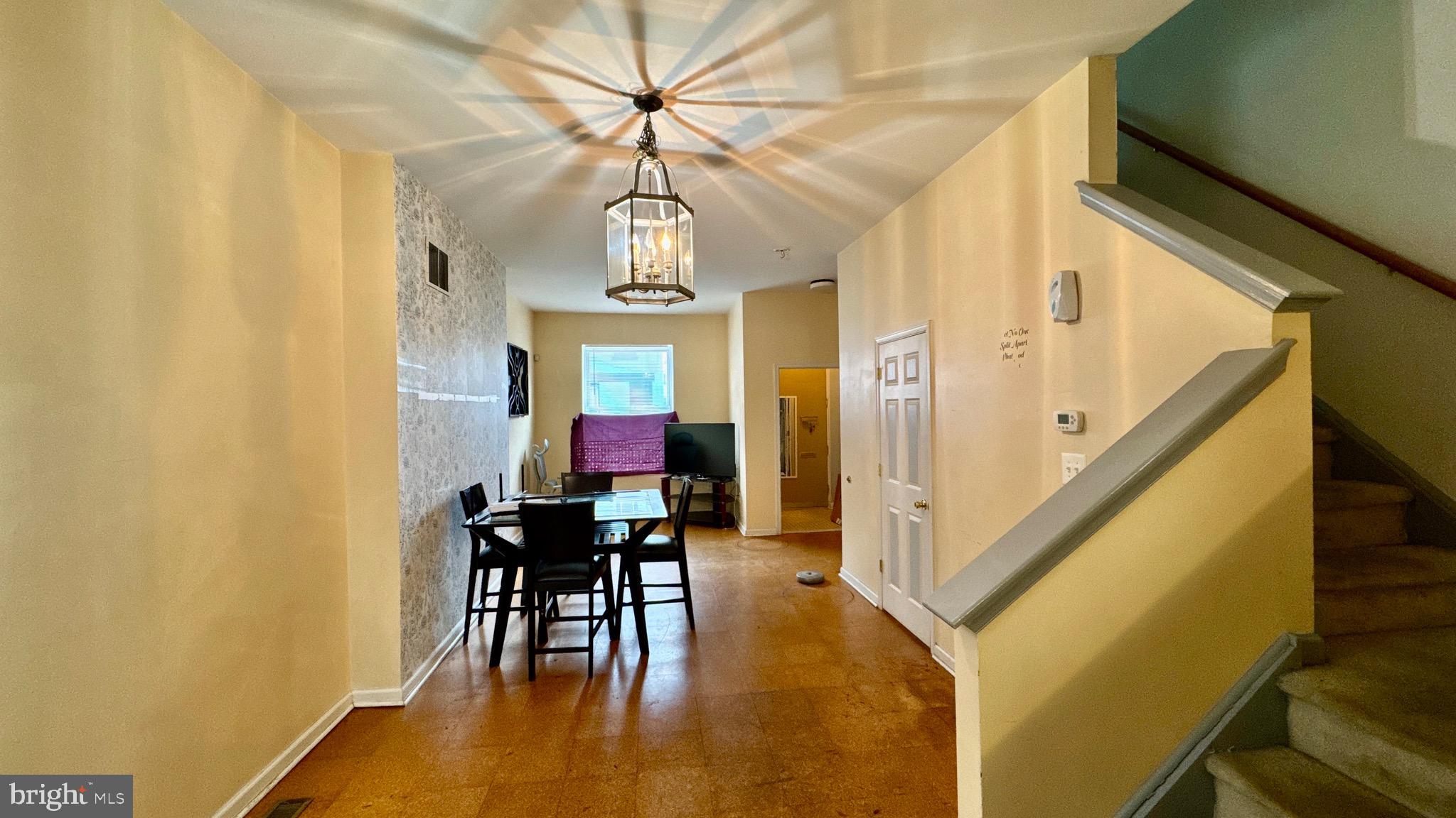 1934 North 23rd Street Philadelphia, PA 19121 - Photo 4 of 17 a view of a dining room with furniture window and wooden floor