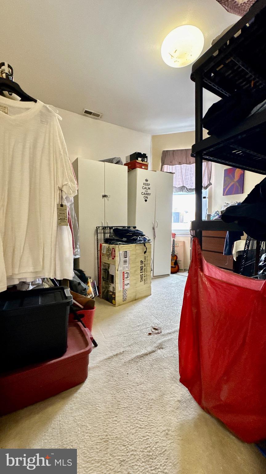 1934 North 23rd Street Philadelphia, PA 19121 - Photo 9 of 17 a living room with furniture a flat screen tv and a sink