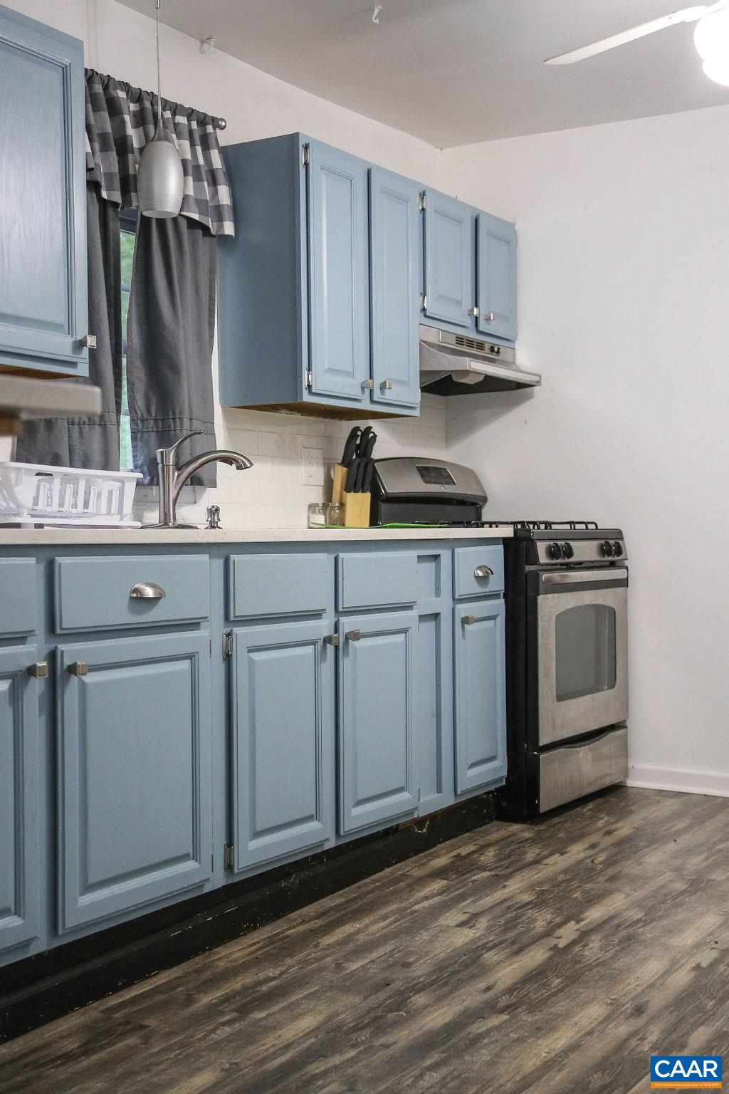 6473 Plank Road Afton, VA 22920 - Photo 28 of 66 a kitchen with stainless steel appliances granite countertop a sink a stove and cabinets