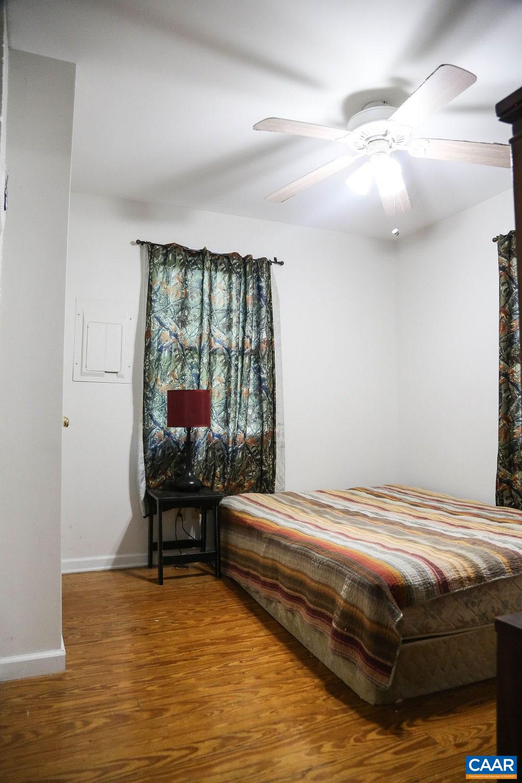 6473 Plank Road Afton, VA 22920 - Photo 45 of 66 a bedroom with a bed and a table in it