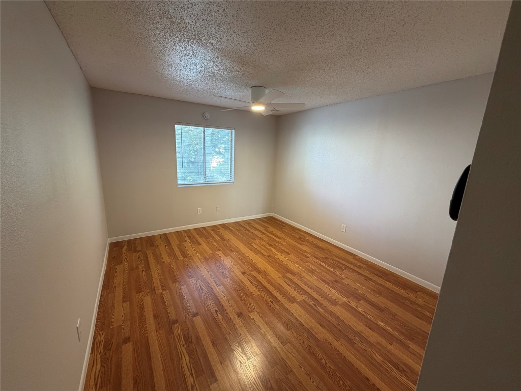 1725 Toomey Road, Unit 310 Austin, TX 78704 - Photo 11 of 11 a view of empty room with wooden floor