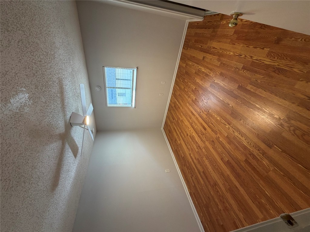 1725 Toomey Road, Unit 310 Austin, TX 78704 - Photo 9 of 11 wooden floor in an empty room