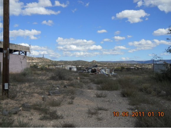 6020 Bice Road Rimrock, AZ 86335 - Photo 2 of 18 a view of a dry yard with wooden fence