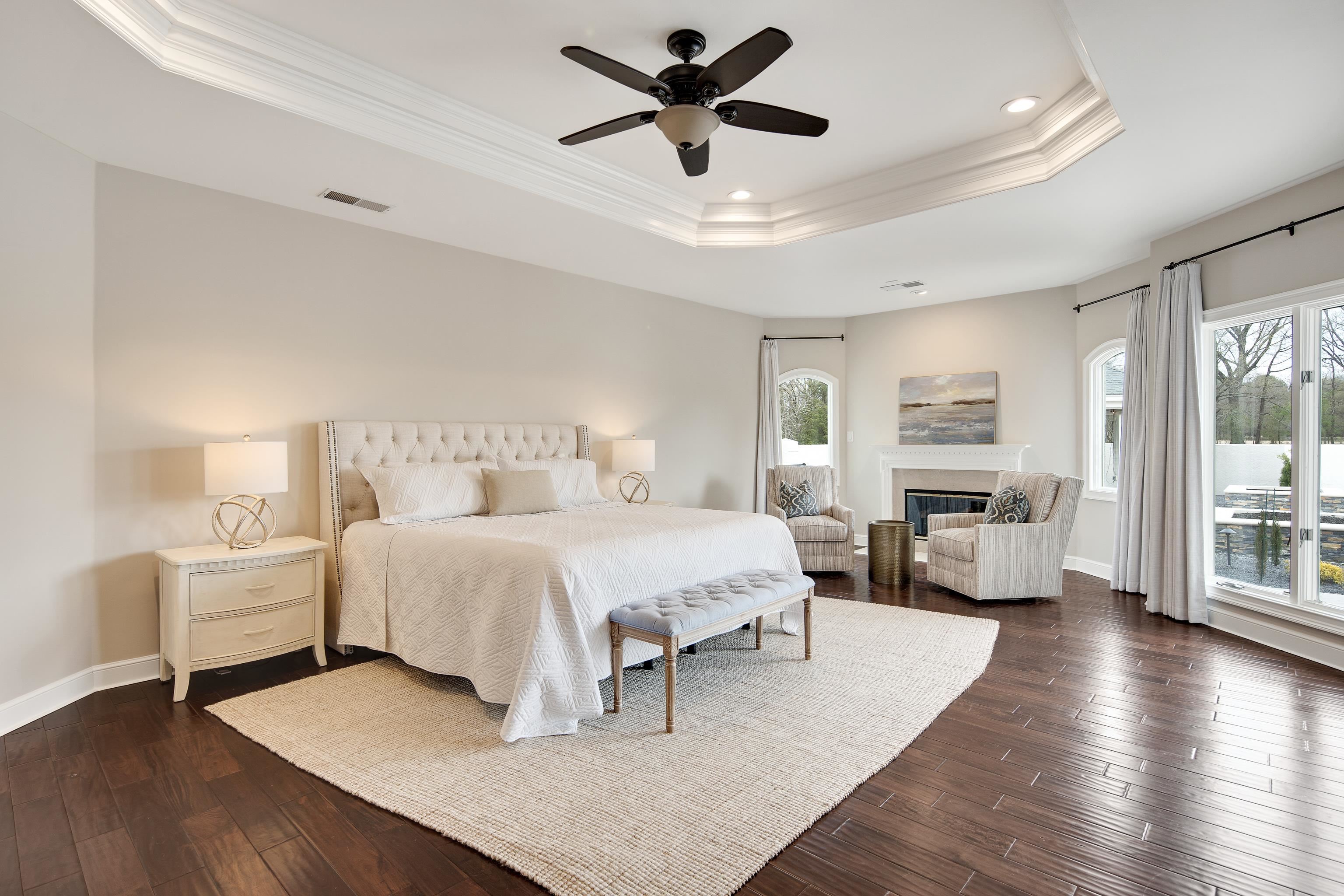 10471 Collierville Road Collierville, TN 38017 - Photo 12 of 40 Bedroom with ornamental molding, a tray ceiling, and dark wood-style flooring