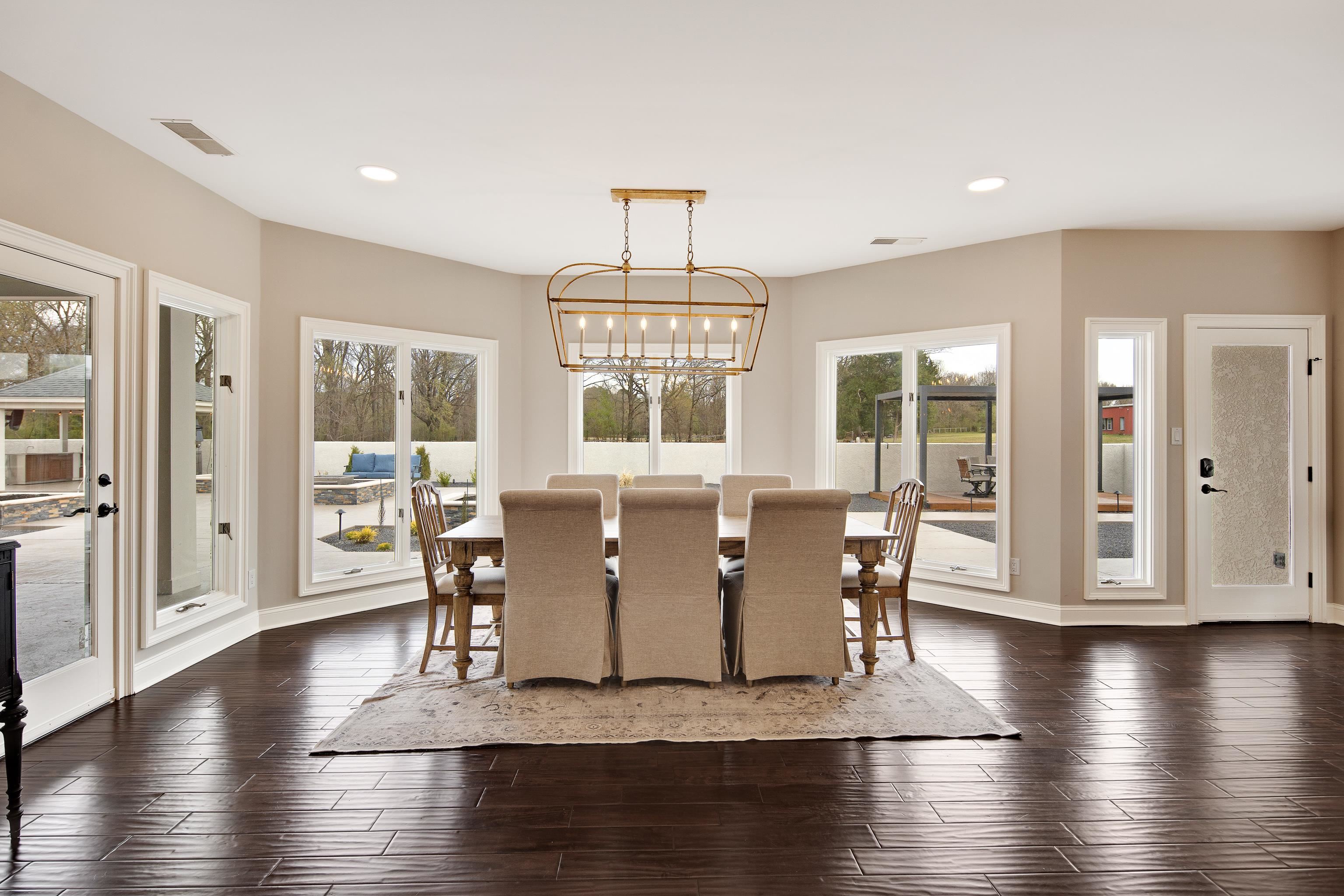 10471 Collierville Road Collierville, TN 38017 - Photo 10 of 40 Dining room with recessed lighting, visible vents, dark wood finished floors, and a chandelier