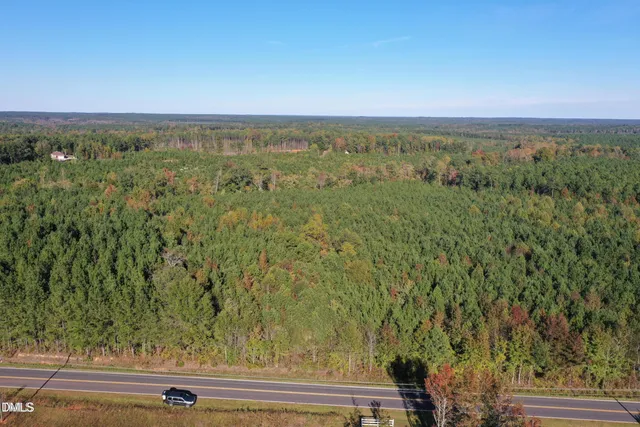 an aerial view of house with yard