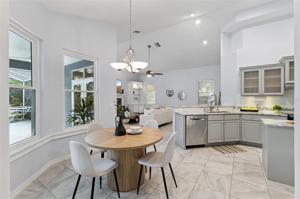 2125 Kane Park Way Windermere, FL 34786 - Photo 18 of 63 a kitchen with a dining table chairs and sink