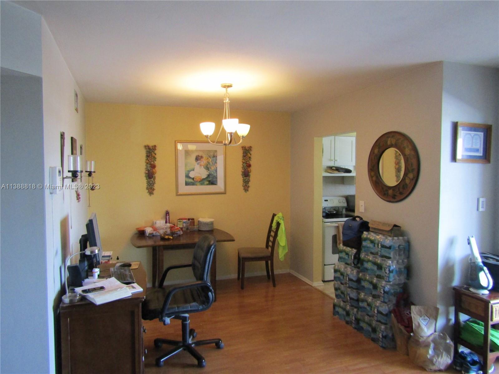 651 Pine Drive, Unit 309 Pompano Beach, FL 33060 - Photo 12 of 38 a view of a workspace with furniture and a fan