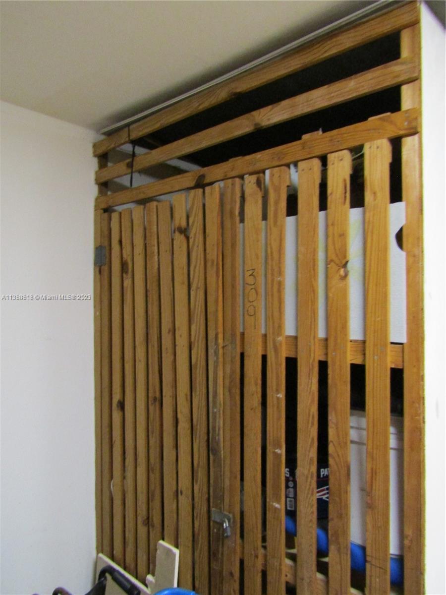 651 Pine Drive, Unit 309 Pompano Beach, FL 33060 - Photo 29 of 38 a view of a door with wooden floor