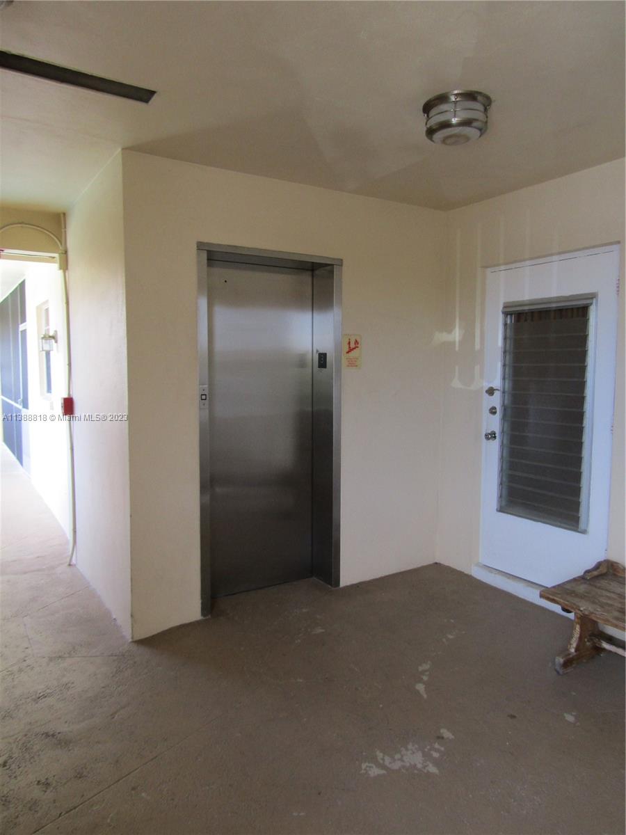 651 Pine Drive, Unit 309 Pompano Beach, FL 33060 - Photo 32 of 38 an empty room with windows and closet