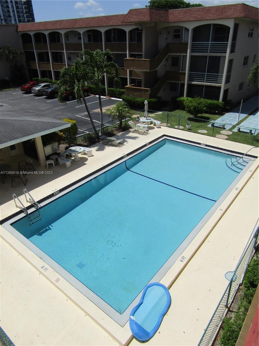 651 Pine Drive, Unit 309 Pompano Beach, FL 33060 - Photo 33 of 38 a view of a house with backyard and sitting area