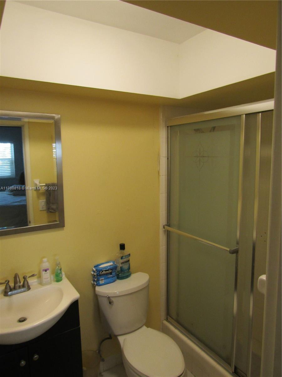 651 Pine Drive, Unit 309 Pompano Beach, FL 33060 - Photo 8 of 38 a bathroom with a toilet a sink and shower