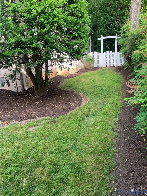 2907 Sweetspire Ridge Midlothian, VA 23113 - Photo 4 of 19 Side yard leading to fenced wooded rear yard!