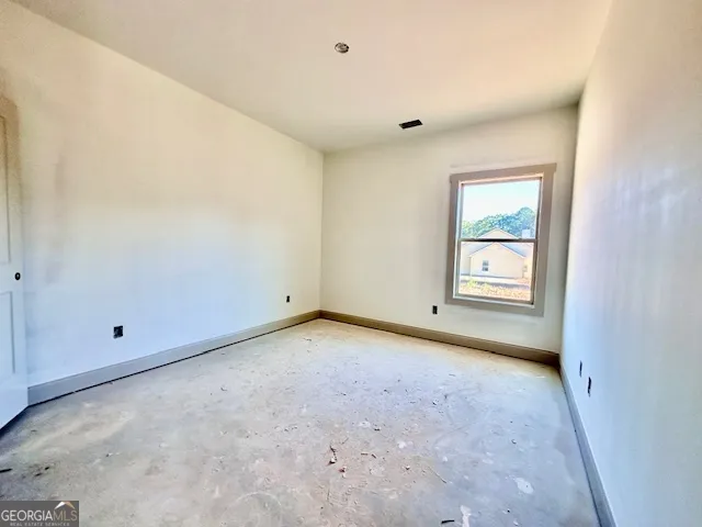 an empty room with windows
