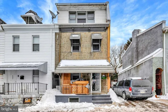 a front view of a house with parking space