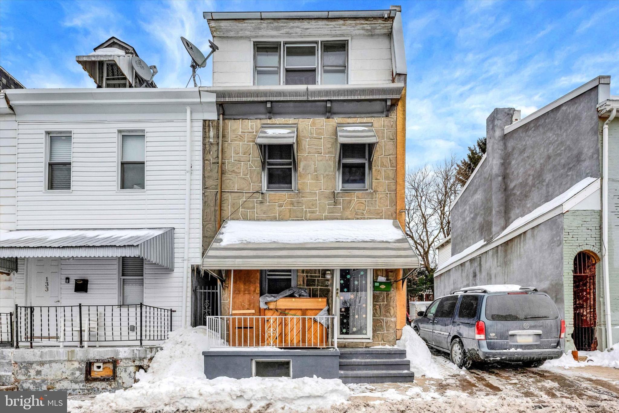 131 Mulberry Street Reading, PA 19601 - Photo 1 of 24 a front view of a house with parking space