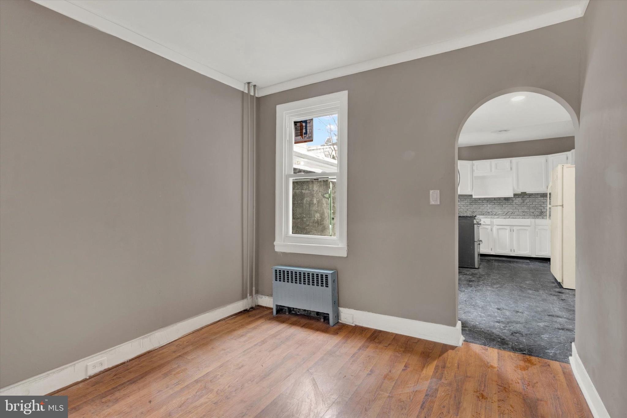 131 Mulberry Street Reading, PA 19601 - Photo 4 of 24 a view of a room with wooden floor and a window