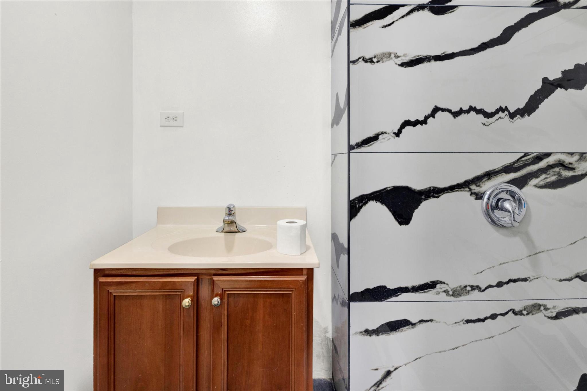 131 Mulberry Street Reading, PA 19601 - Photo 10 of 24 a bathroom with a sink and a mirror