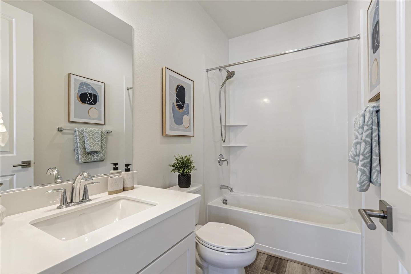 1907 Joshua Tree Circle Milpitas, CA 95035 - Photo 21 of 37 a bathroom with a sink toilet a mirror and shower