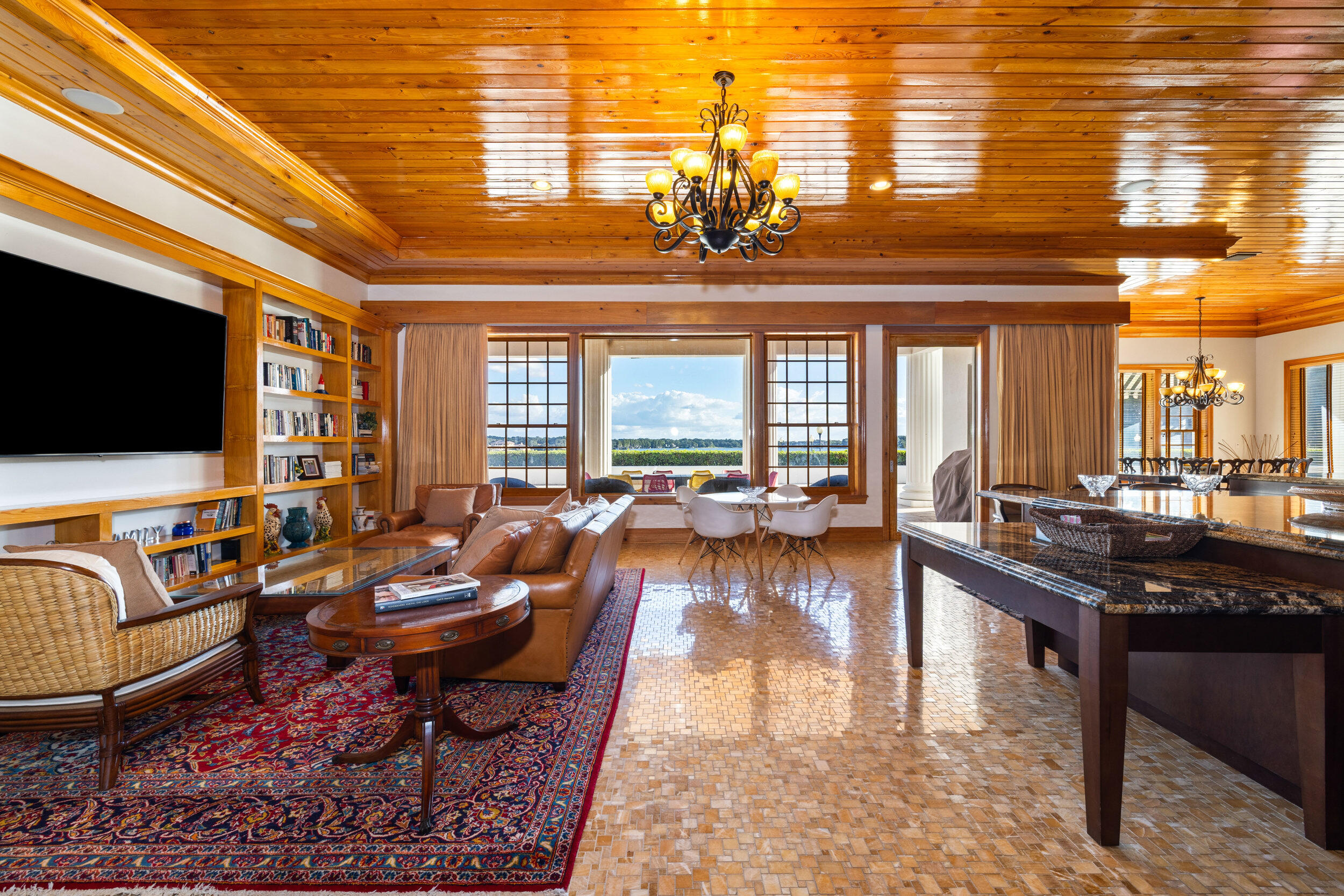 9508 Windy Ridge Road Windermere, FL 34786 - Photo 13 of 49 a living room with furniture and a flat screen tv