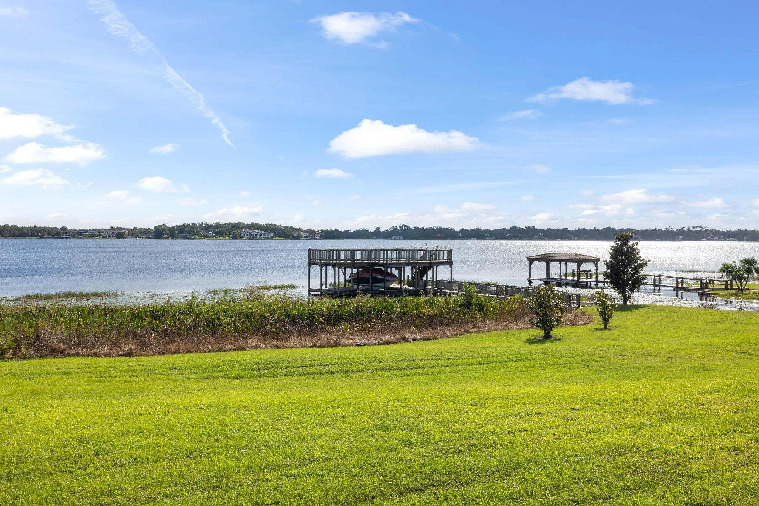 9508 Windy Ridge Road Windermere, FL 34786 - Photo 36 of 49 a view of a lake with houses in the back