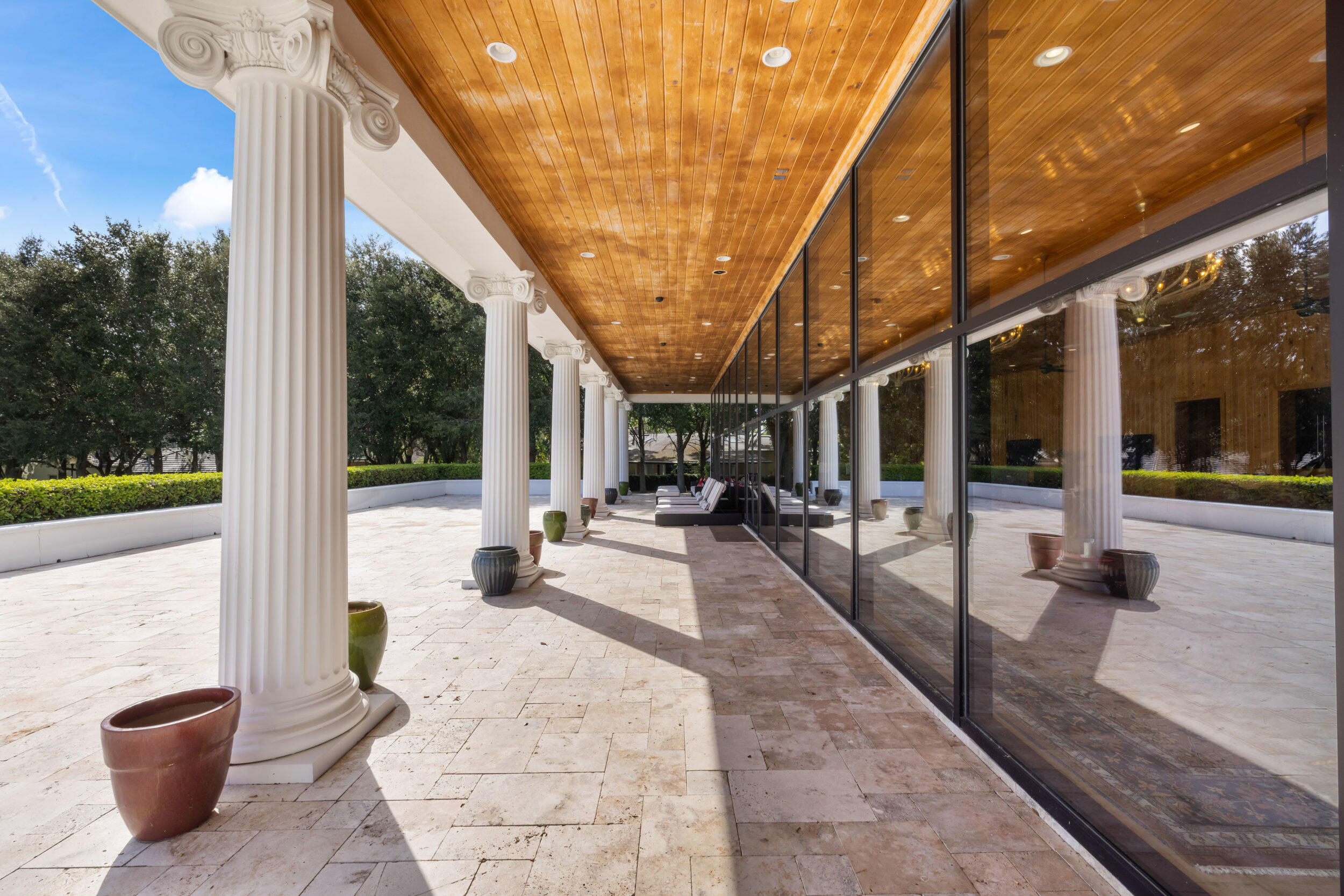 9508 Windy Ridge Road Windermere, FL 34786 - Photo 39 of 49 a view of a patio with a dining table and chairs