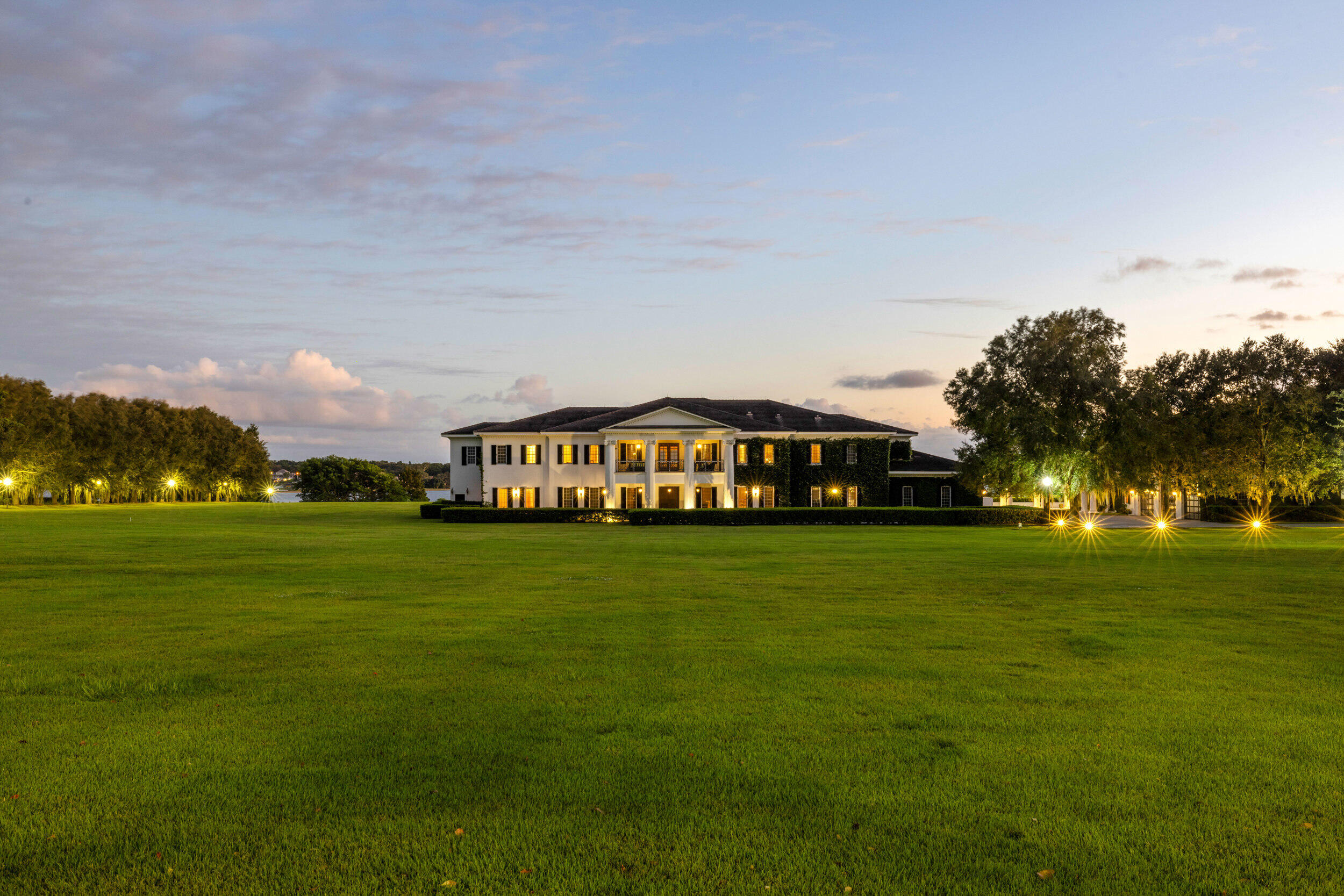 9508 Windy Ridge Road Windermere, FL 34786 - Photo 44 of 49 a front view of a house with a garden