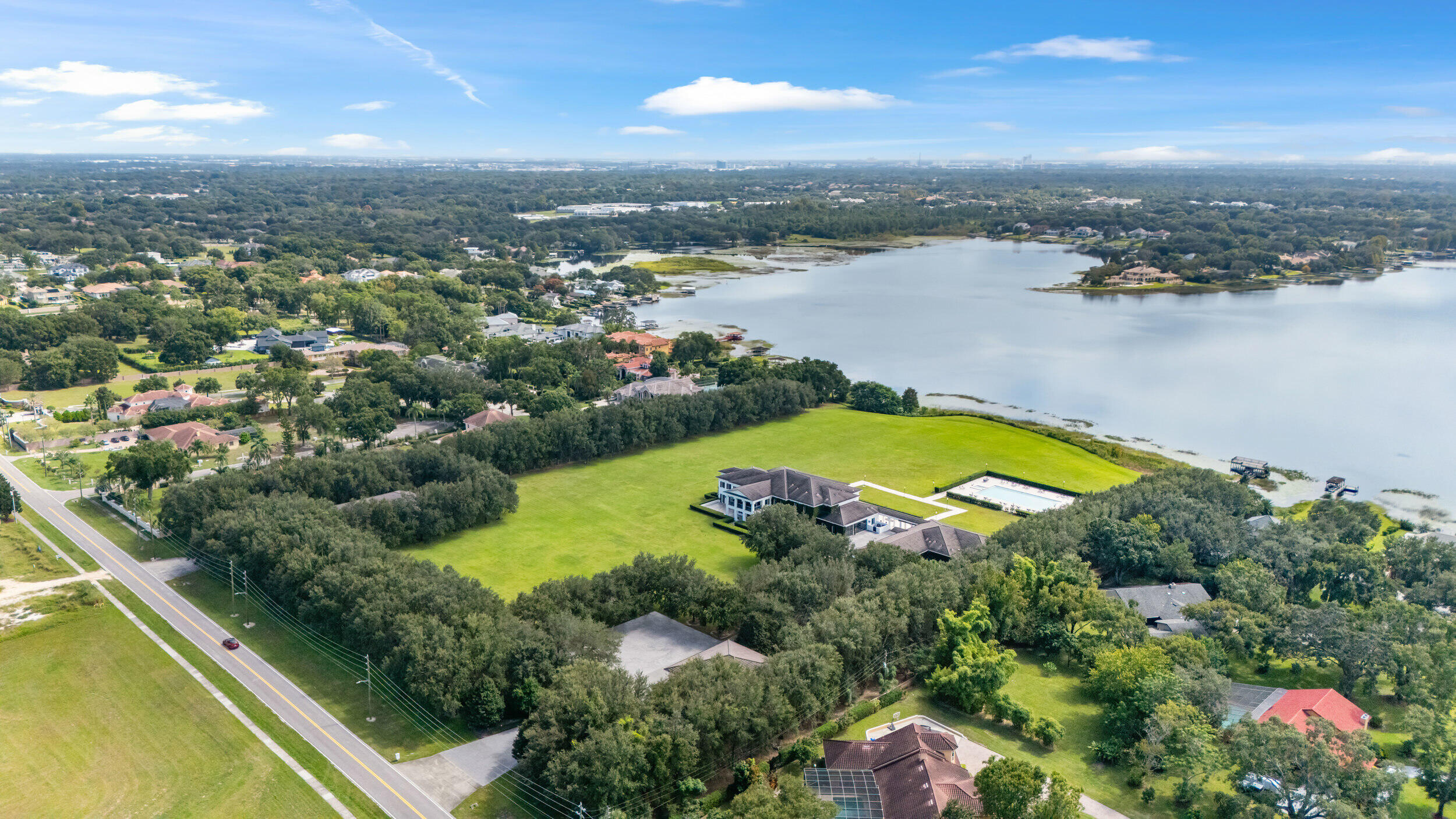 9508 Windy Ridge Road Windermere, FL 34786 - Photo 5 of 49 an aerial view of residential houses with outdoor space and lake view