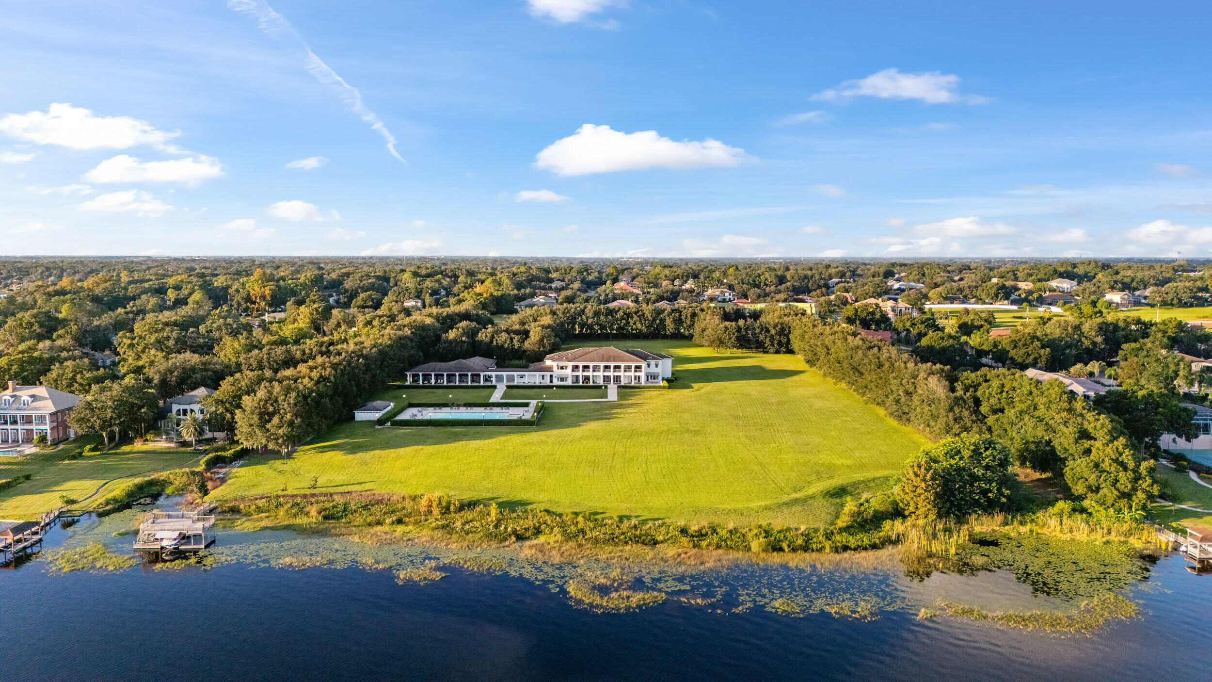 9508 Windy Ridge Road Windermere, FL 34786 - Photo 6 of 49 a view of a swimming pool with an ocean view