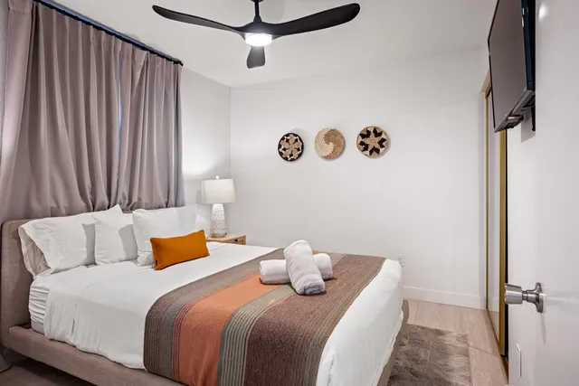 a bedroom with a bed and a table