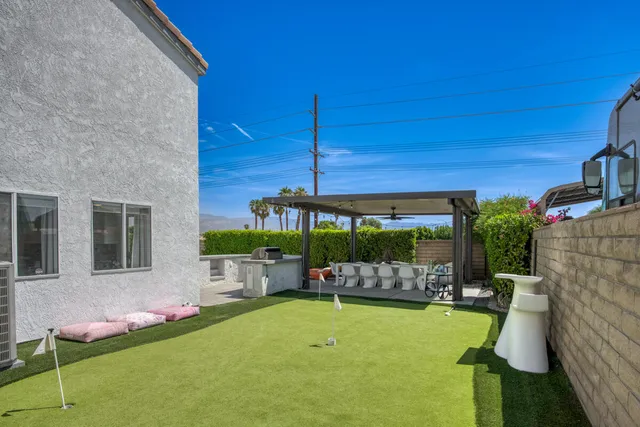 a view of an chairs and tables in the patio