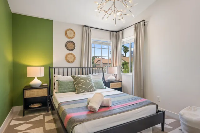 a bedroom with a bed and a table in it