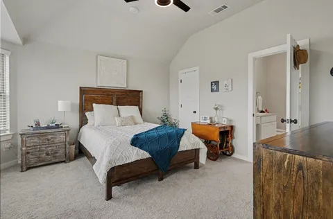 a bedroom with furniture and window