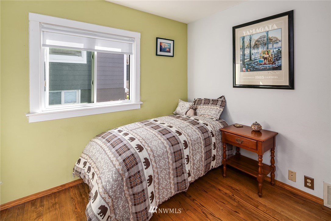 342 Northwest 48th Street Seattle, WA 98107 - Photo 15 of 20 a bedroom with a bed and a window