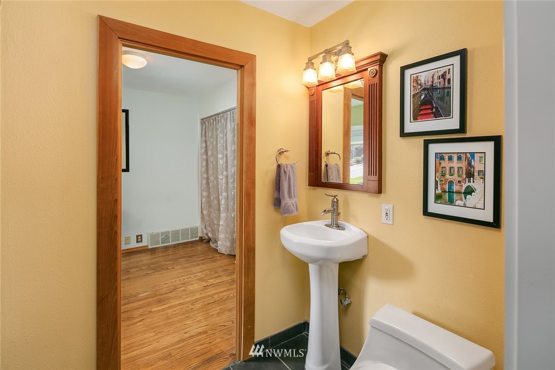 342 Northwest 48th Street Seattle, WA 98107 - Photo 16 of 20 a bathroom with a sink and a mirror