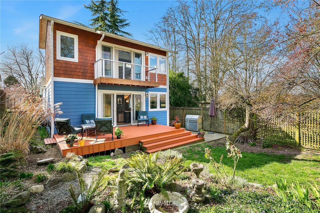 342 Northwest 48th Street Seattle, WA 98107 - Photo 18 of 20 a view of a house with backyard sitting area and garden