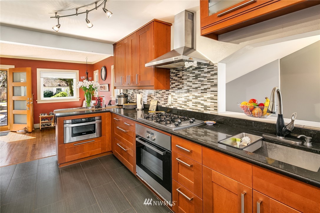 342 Northwest 48th Street Seattle, WA 98107 - Photo 6 of 20 a kitchen with stainless steel appliances granite countertop a stove and a sink