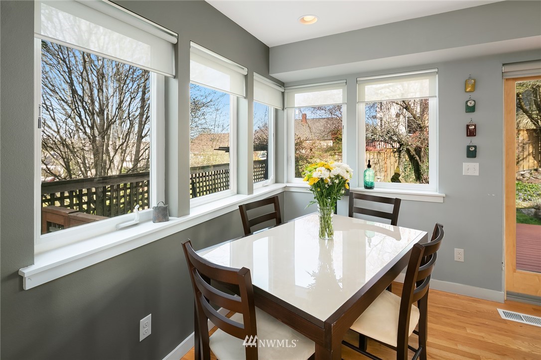 342 Northwest 48th Street Seattle, WA 98107 - Photo 8 of 20 a view of a dining room with furniture window and wooden floor