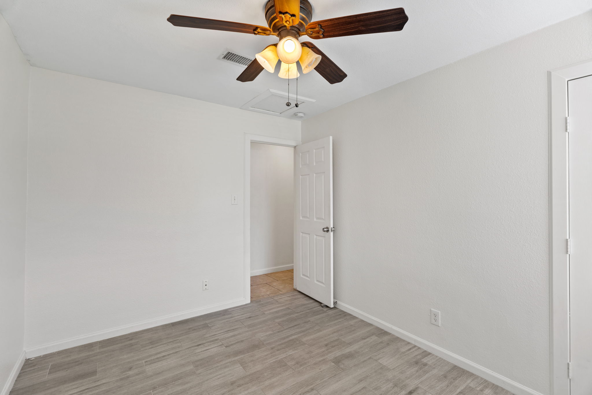 2604 Cockburn Drive Austin, TX 78745 - Photo 14 of 34 A bedroom that feels airy, peaceful, and ready to unwind.