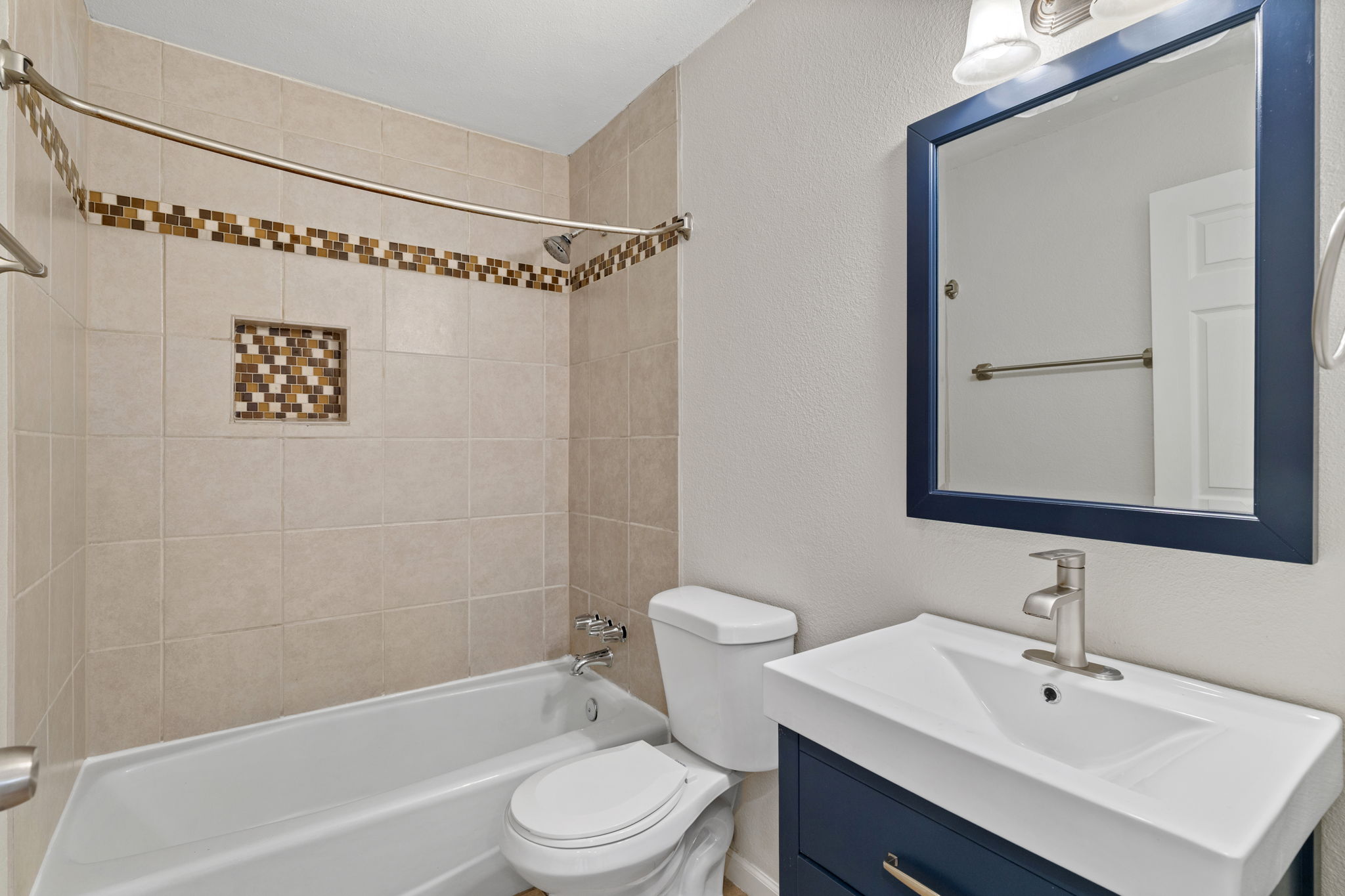 2604 Cockburn Drive Austin, TX 78745 - Photo 16 of 34 Fresh, updated hall bath with crisp finishes and a clean, modern look that feels bright and inviting.