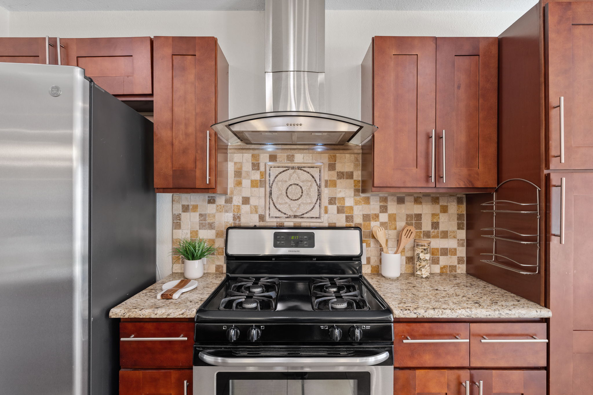 2604 Cockburn Drive Austin, TX 78745 - Photo 30 of 34 Warm wood cabinetry and stainless appliances bring style and function to the heart of the home.