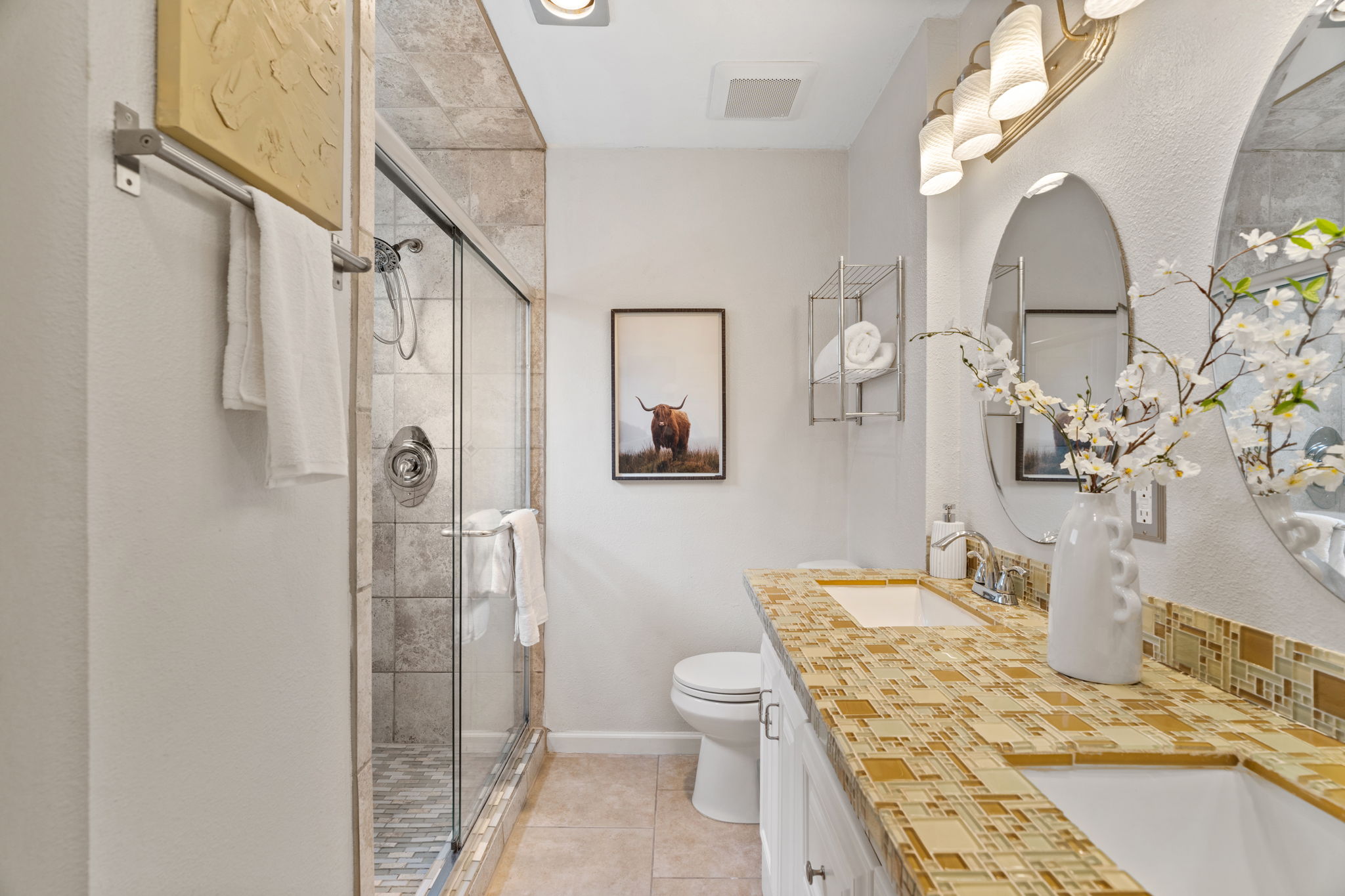 2604 Cockburn Drive Austin, TX 78745 - Photo 5 of 34 The primary bathroom offers double sinks and generous counter space so mornings feel calm instead of crowded.