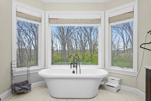 a bedroom with furniture and a window