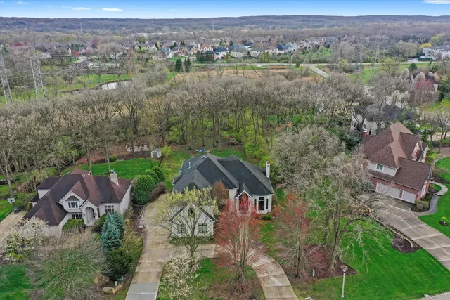 an aerial view of a house with garden space and outdoor seating