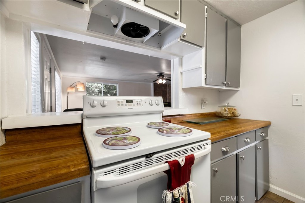 5048 Big Bend Road Oroville, CA 95965 - Photo 28 of 72 a kitchen with a stove and a microwave