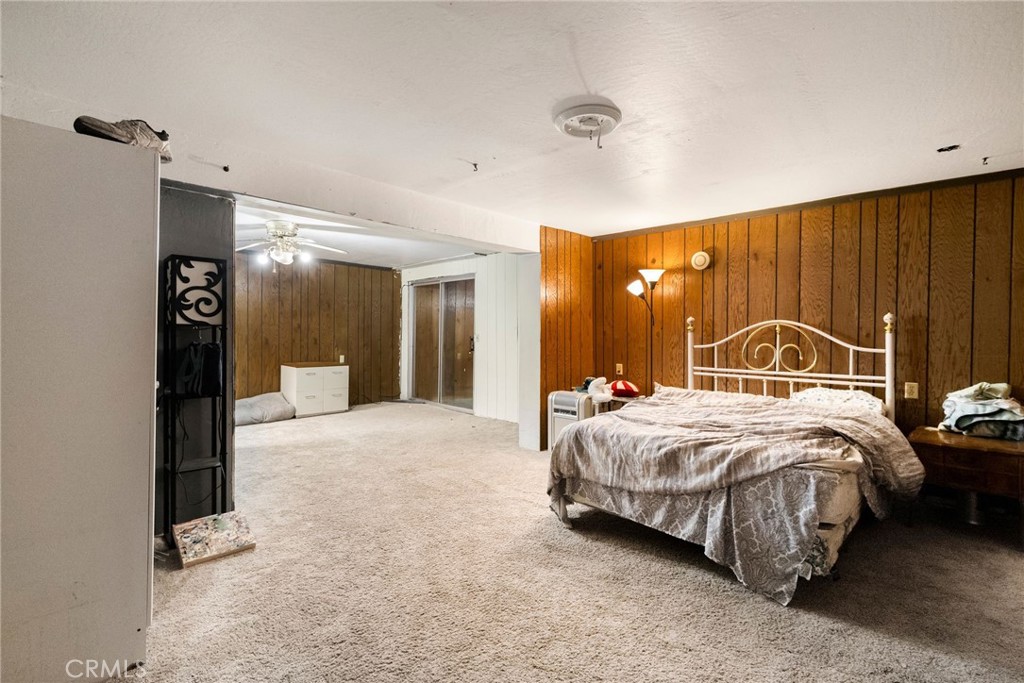 5048 Big Bend Road Oroville, CA 95965 - Photo 39 of 75 a spacious bedroom with a bed and a mirror
