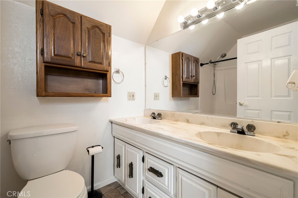 5048 Big Bend Road Oroville, CA 95965 - Photo 42 of 75 a bathroom with a sink a toilet and mirror